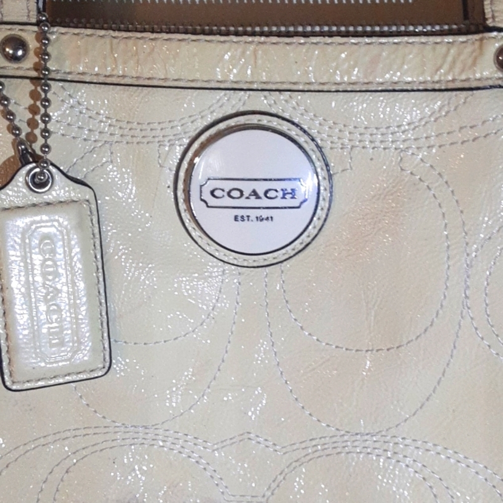 Coach bag cream with green interior.